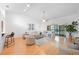 Bright living room, hardwood floors, neutral decor and access to balcony at 842 Amelia Ne Ct, St Petersburg, FL 33702