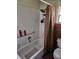 Bathroom with shower/tub combo and patterned curtain at 3447 Monte Rio St, New Port Richey, FL 34655