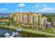 Luxury waterfront condo building with marina views and resort-style amenities at 610 Riviera Dunes Way # 101, Palmetto, FL 34221