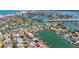 Stunning aerial view showcases homes along winding canals, offering waterfront living with easy boating access at 240 N Julia Cir, St Pete Beach, FL 33706