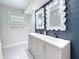 Elegant bathroom featuring a double sink vanity, modern fixtures, and stylish decor at 240 N Julia Cir, St Pete Beach, FL 33706