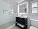 Modern bathroom features a glass shower, updated vanity, and recessed lighting at 240 N Julia Cir, St Pete Beach, FL 33706