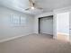 Bedroom featuring neutral tones, a ceiling fan, and closet space at 240 N Julia Cir, St Pete Beach, FL 33706