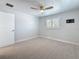 Bright bedroom featuring neutral tones, carpet, and a ceiling fan, perfect for relaxation at 240 N Julia Cir, St Pete Beach, FL 33706