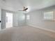 Bedroom with carpet, ample natural light, and ceiling fan at 240 N Julia Cir, St Pete Beach, FL 33706