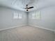 Inviting bedroom featuring neutral tones, natural light, and carpet, creating a serene atmosphere at 240 N Julia Cir, St Pete Beach, FL 33706