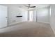 Spacious bedroom with carpet, ample natural light, and ceiling fan at 240 N Julia Cir, St Pete Beach, FL 33706