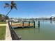 Private backyard dock with deep-water access, ideal for boating and fishing at 240 N Julia Cir, St Pete Beach, FL 33706