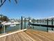Home dock with boat lift overlooking the water at 240 N Julia Cir, St Pete Beach, FL 33706