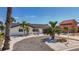 Charming single-story home featuring a modern garage door, well-maintained driveway, and lush landscaping at 240 N Julia Cir, St Pete Beach, FL 33706