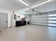 Spacious two-car garage with an epoxy floor and a work bench at 240 N Julia Cir, St Pete Beach, FL 33706