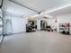 Well lit garage with epoxy flooring and lots of storage space at 240 N Julia Cir, St Pete Beach, FL 33706