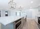 Spacious kitchen island featuring stainless steel appliances and modern design elements at 240 N Julia Cir, St Pete Beach, FL 33706