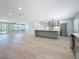 Open concept kitchen featuring a large island, stainless appliances, and ample countertop space at 240 N Julia Cir, St Pete Beach, FL 33706