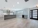 Spacious kitchen with a gray island, stainless steel appliances, and a window with natural light at 240 N Julia Cir, St Pete Beach, FL 33706