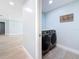 Convenient laundry room with a side-by-side washer and dryer at 240 N Julia Cir, St Pete Beach, FL 33706