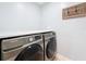 Laundry room with modern machines and overhead shelf at 240 N Julia Cir, St Pete Beach, FL 33706
