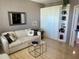 Cozy living room with comfortable sofa and built-in shelving at 7974 S Sailboat Key Blvd # 803, South Pasadena, FL 33707