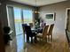 Bright dining area with table and chairs, offering a water view at 7974 S Sailboat Key Blvd # 803, South Pasadena, FL 33707