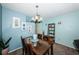 Charming dining area with a glass-top table and four chairs at 5969 Terrace Park N Dr # 304, St Petersburg, FL 33709