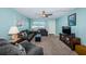 Bright living room featuring comfy seating and a large TV at 5969 Terrace Park N Dr # 304, St Petersburg, FL 33709