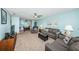 Bright living room with comfy sofas at 5969 Terrace Park N Dr # 304, St Petersburg, FL 33709