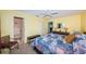 Bright bedroom with a king-size bed and access to a bathroom at 5969 Terrace Park N Dr # 304, St Petersburg, FL 33709