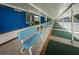 Covered shuffleboard court area with benches at 5969 Terrace Park N Dr # 304, St Petersburg, FL 33709