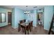 Bright dining area with a glass-top table and four chairs at 5969 Terrace Park N Dr # 304, St Petersburg, FL 33709