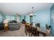 Open living and dining space with seating and dining table at 5969 Terrace Park N Dr # 304, St Petersburg, FL 33709