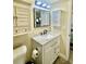Bathroom with vanity, sink, and medicine cabinet at 1223 Queen Anne Dr # C, Palm Harbor, FL 34684