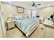 Spacious main bedroom with light and airy decor, featuring a large bed and plenty of storage at 1223 Queen Anne Dr # C, Palm Harbor, FL 34684