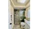 Updated bathroom with walk-in shower, new vanity, and modern fixtures at 1223 Queen Anne Dr # C, Palm Harbor, FL 34684