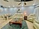 Spacious living area with light-colored leather furniture at 1223 Queen Anne Dr # C, Palm Harbor, FL 34684
