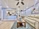 Open concept living space with light walls and comfortable seating at 1223 Queen Anne Dr # C, Palm Harbor, FL 34684