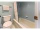 Light blue full bath with shower-tub combo and tile surround at 1380 Gulf Blvd # 307, Clearwater Beach, FL 33767
