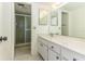 Bathroom with a walk-in shower, single sink vanity, and mosaic tile floor at 1380 Gulf Blvd # 307, Clearwater Beach, FL 33767