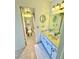 Neutral bathroom with a single sink vanity and a patterned tile floor in the shower area at 1380 Gulf Blvd # 307, Clearwater Beach, FL 33767