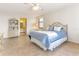 Bright and spacious bedroom with ceramic tile flooring and a view of an ensuite bath at 1380 Gulf Blvd # 307, Clearwater Beach, FL 33767