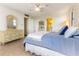 Bright bedroom features tile floors, closet, and adjacent bathroom at 1380 Gulf Blvd # 307, Clearwater Beach, FL 33767
