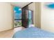 Bedroom with sliding glass doors leading to balcony and ocean view at 1380 Gulf Blvd # 307, Clearwater Beach, FL 33767