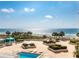 Beautiful view of community pool overlooking the ocean, offering relaxation and recreation for residents at 1380 Gulf Blvd # 307, Clearwater Beach, FL 33767