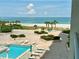 Overhead view of community pool and ocean, great for relaxation and outdoor enjoyment at 1380 Gulf Blvd # 307, Clearwater Beach, FL 33767