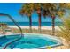 Relaxing hot tub overlooking the beach with swaying palms and ocean view at 1380 Gulf Blvd # 307, Clearwater Beach, FL 33767