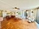 Spacious living room with tile floors and dining area at 1380 Gulf Blvd # 307, Clearwater Beach, FL 33767