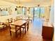 Bright living room and dining area with sliding glass doors to a balcony at 1380 Gulf Blvd # 307, Clearwater Beach, FL 33767