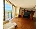 Living room with hardwood floors, ocean views, and access to the balcony at 1380 Gulf Blvd # 307, Clearwater Beach, FL 33767