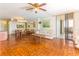Bright living room with parquet floors, dining area, and sliding door to a patio at 1380 Gulf Blvd # 307, Clearwater Beach, FL 33767