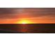 Beautiful ocean sunset casts an orange glow over the water at 1380 Gulf Blvd # 307, Clearwater Beach, FL 33767