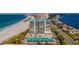 Aerial view of beachfront building with parking and ocean at 1380 Gulf Blvd # 307, Clearwater Beach, FL 33767